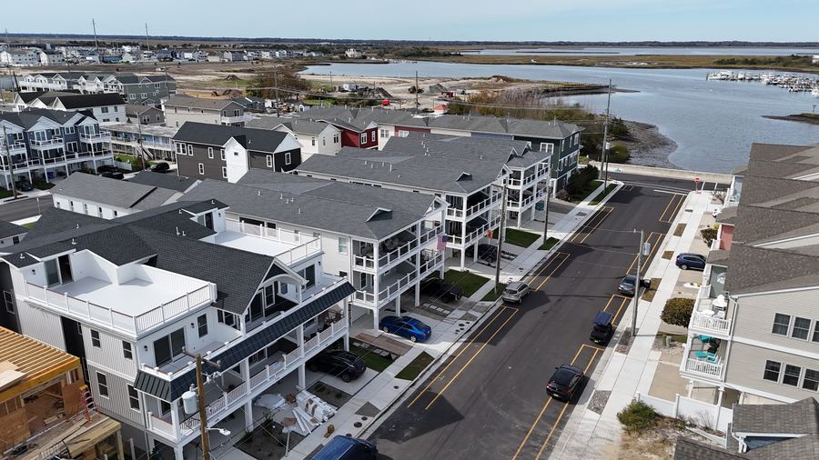 Aerial view of the Wildwood home with the bay and marshland in the distance