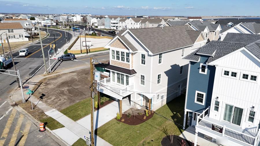 New home in North Wildwood with a fresh lawn and landscaping